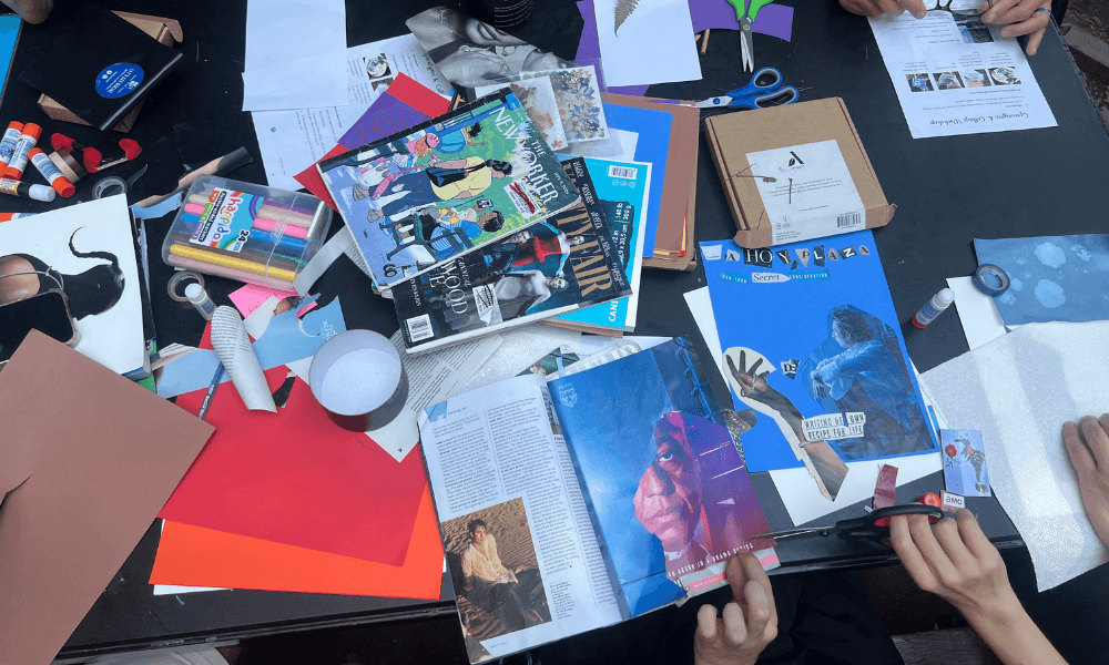 Collage materials sit on a table in Washington Square Park.