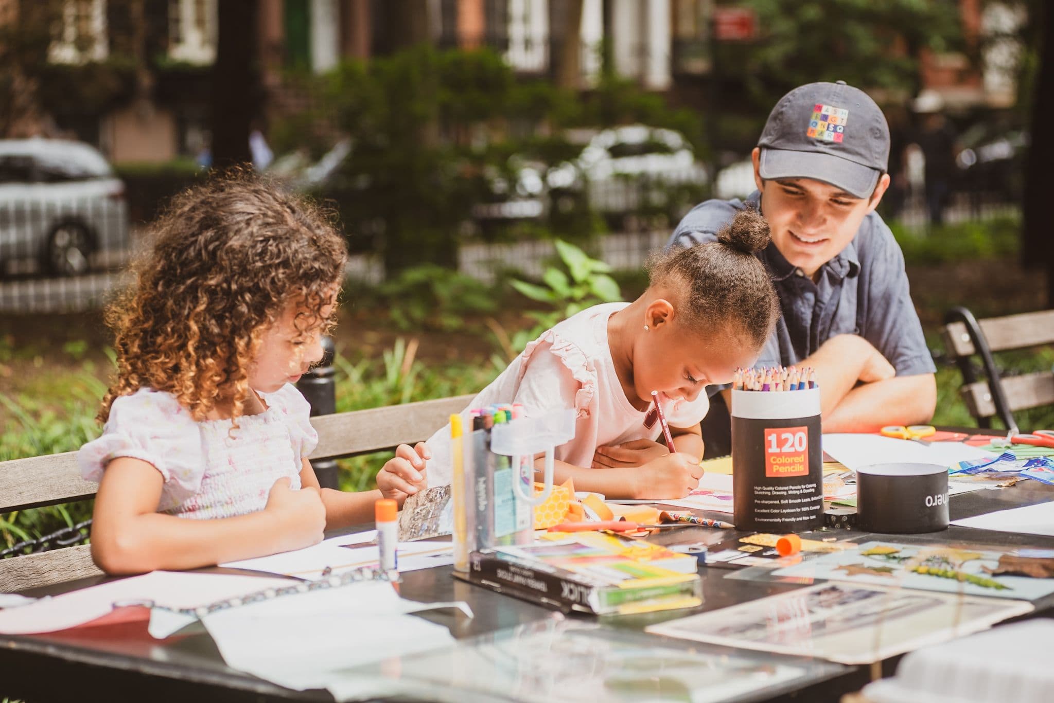 Conservancy staff work with young park visitors at an Open Park Studio workshop.
